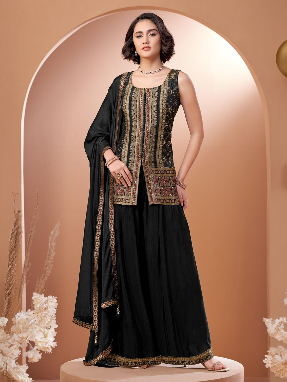Striking elegance unfolds in this black silk palazzo suit adorned with aabla,